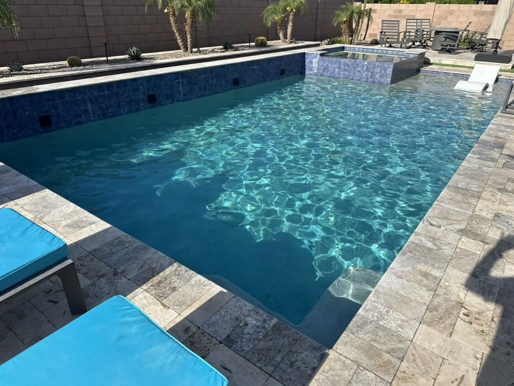 Rectangular pool with raised spa and water feature in Queen Creek, AZ
