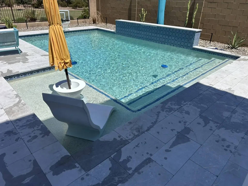 Compact pool with Baja shelf and water feature in Queen Creek, AZ