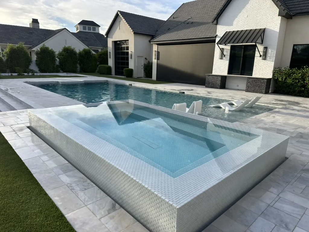 Glass spa with modern pool and sun shelf in Gilbert, AZ