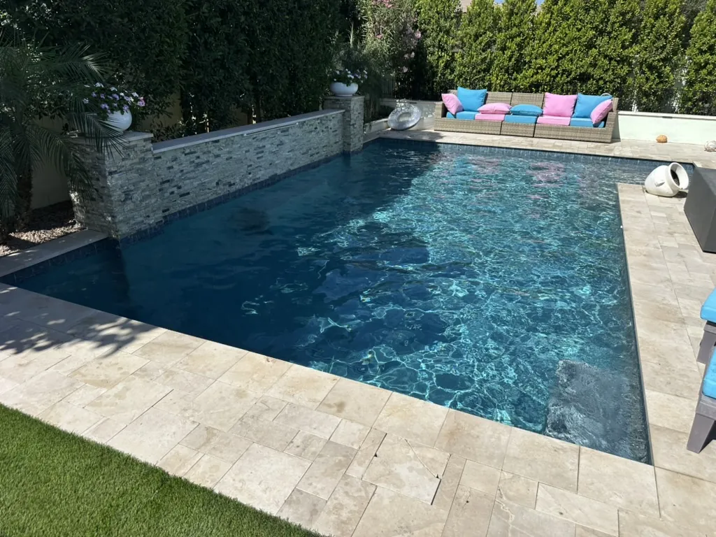 Rectangular pool with stone water feature