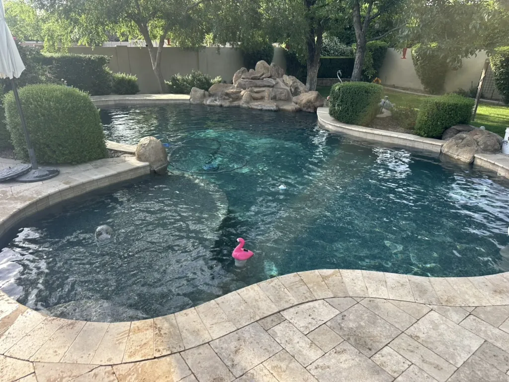 Lagoon-style pool with rock waterfall