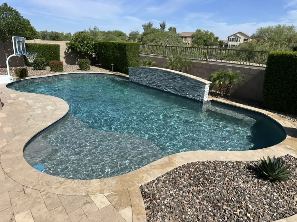 Freeform pool with Baja shelf and water feature in Queen Creek, AZ