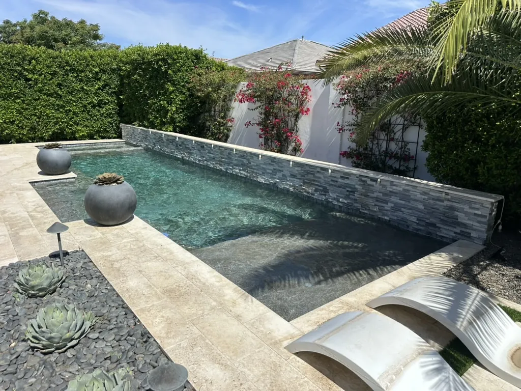 Narrow modern pool with long water feature