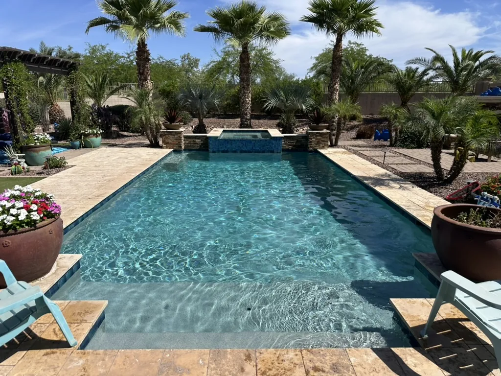 Tropical lap pool with raised spa in Gilbert, AZ