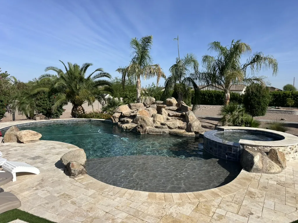 Lagoon pool with rock waterfall and spa
